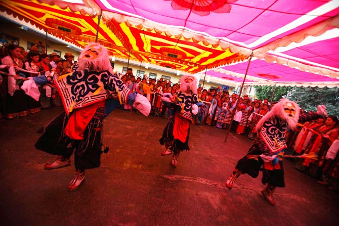 Tibetans performs a traditional mask dance to celebrate the 77th birthday of their spiritual leader the Dalai Lama in Kathmandu. ? Photo by Reuters