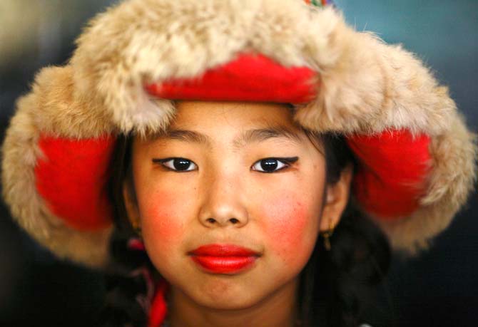 A Tibetan girl dressed in traditional attire is pictured during the 77th birthday celebration of the exiled spiritual leader the Dalai Lama in Kathmandu. ? Photo by Reuters
