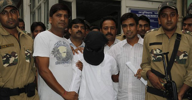 Delhi-police-officers-escort-Syed-Zabiuddin-Ansari670 Delhi police officers escort Syed Zabiuddin Ansari.—AP Photo
