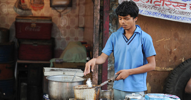 Indian-child-labourer-Ram-Singh-making-tea-at-a-shop-in-old-quarters-of-New-Delhi670 Indian child labourer Ram Singh making tea at a shop in old quarters of New Delhi.—AFP Photo
