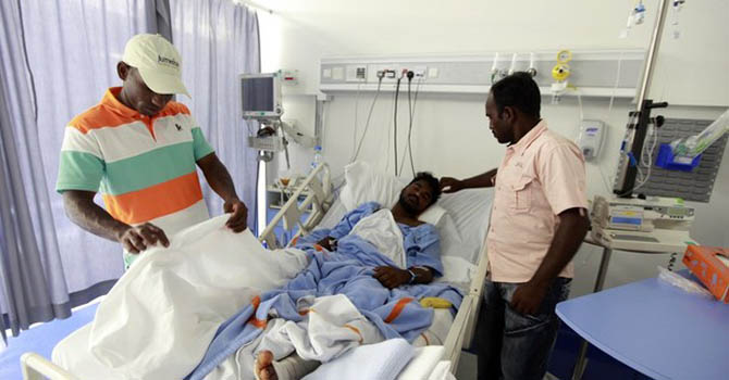 Friends of Muthu Muniraj, one of the fishermen injured at sea on Monday, check on him as he sleeps in the emergency ward at a hospital in Dubai Friends of Muthu Muniraj, one of the fishermen injured at sea on Monday, check on him as he sleeps in the emergency ward at a hospital in Dubai, July 17, 2012. Indian fishermen who survived a hail of gunfire from a U.S. navy boat off the coast of the United Arab Emirates disputed U.S. claims that their boat drew fire after ignoring warnings to steer clear of the American vessel. One Indian national was killed and three others injured on Monday when the USNS Rappahannock, a refuelling ship, fired on the fishing vessel, which the U.S. Navy's Fifth Fleet approached at high speed and ignored repeated warnings. REUTERS/Jumana ElHeloueh (UNITED ARAB EMIRATES - Tags: POLITICS SOCIETY)