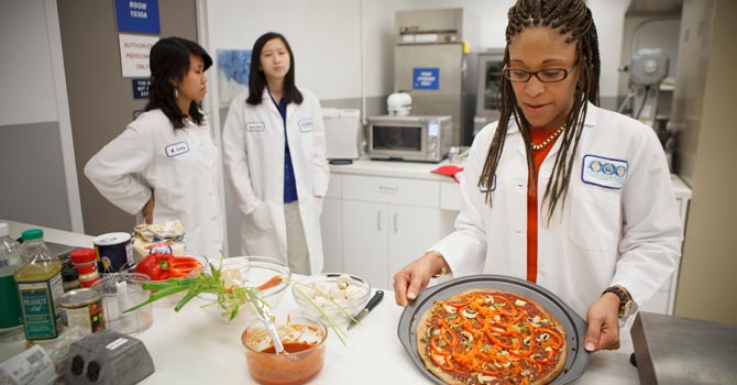 Lockeed-Martin-senior-research-scientist-Maya-Cooper-shows-a-vegan-pizza-developed-at-NASA's-Advanced-Food-Technology-Project-at-Johnson-Space-Center-in-Houston670 Lockeed Martin senior research scientist Maya Cooper shows a vegan pizza developed at Nasa's Advanced Food Technology Project at Johnson Space Centre in Houston.—AP Photo
