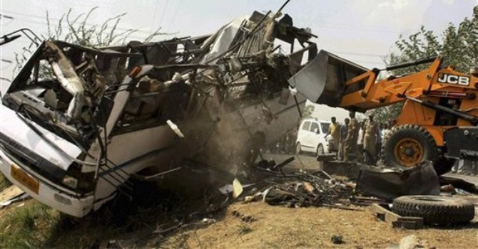 The-wreckage-of-a-passenger-bus670 The wreckage of a passenger bus.—AP Photo
