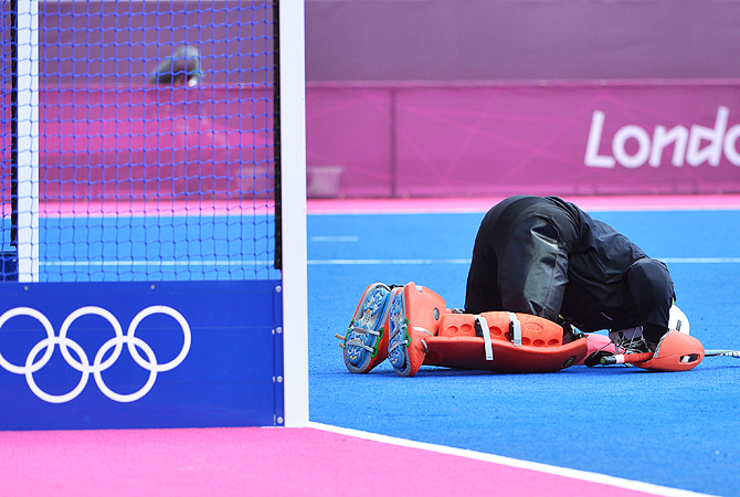 Imran Shah of Pakistan reacts after the match. -Photo by AFP