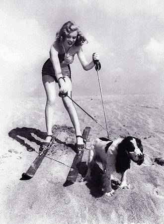 In this January 1, 1947 file photo, starlet Marilyn Monroe plays at the beach with her dog Ruffles. — AP Photo