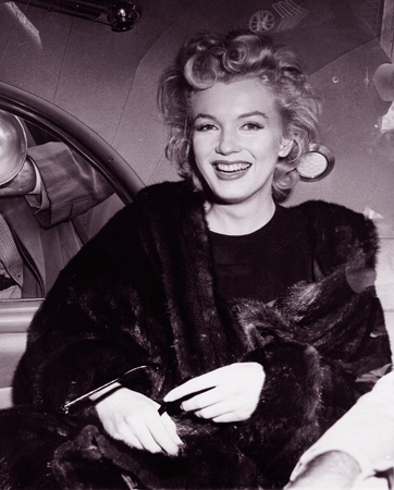 - In this June 2, unknown year, file photo, actress Marilyn Monroe smiles in a car after arriving tousled from an all-night plane flight from Hollywood to Idlewild Airport, in New York. She said she planned to rest in New York before going to England to make a new movie with Sir Laurence Olivier. Sidestepping questions as to whether she and playwright Arthur Miller plan to wed, she said: "No comment, we're really good friends." — AP Photo