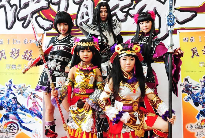 A group of younger fans pose at the festival. - Photo by AFP