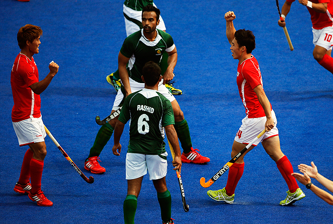 Korea's Hye Sung-hyun , right, celebrates scoring a goal against Pakistan. -Photo by AP