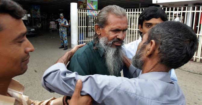 moslemuddin-sarkar-bangladesh-freed-ap2-670 Moslemuddin Sarkar, 52, centre, who had been missing since 1989 is hugged by his brother Sekandar Ali, right, after he arrived at the airport in Dhaka, Bangladesh. For 23 years, Sarkar’s family in Bangladesh thought he was dead. But then an anonymous caller informed a local official in May that he was alive and in jail in Pakistan. — Photo by AP