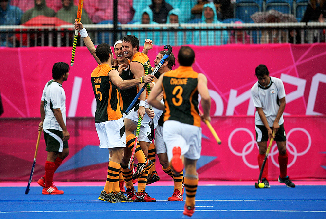 South Africa's Wade Paton (4th L) celebrates scoring a goal.