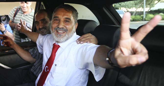 Released hostage Omar, one of 11 Lebanese Shi'ite pilgrims abducted in Syria, flashes a victory sign upon his arrival at Beirut airport