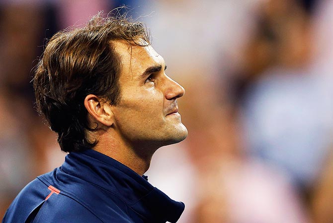 Roger Federer of Switzerland looks up at the crowd following his evening win over Bjorn Phau of Germany. -Photo by Reuters