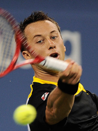 Germany's Philipp Kohlschreiber plays a shot against John Isner of the US during their 2012 US Open men's third round singles match at the USTA Billie Jean King National Tennis Center in New York on September 3, 2012.
