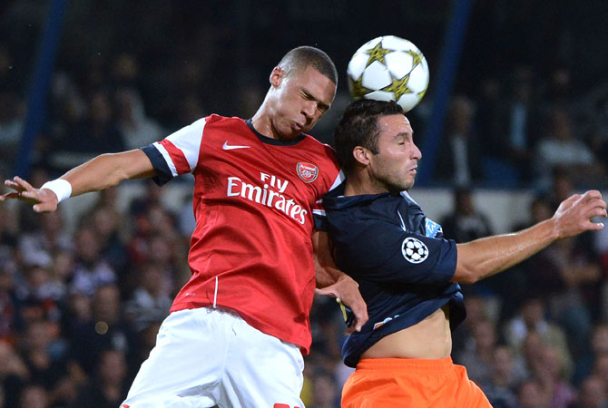 Arsenal's British defender Kieran Gibbs (Left) vies with Montpellier's Argentinian forward Emmanuel Herrera during the UEFA Champions League. Arsenal won 2-1. ? Photo by AFP