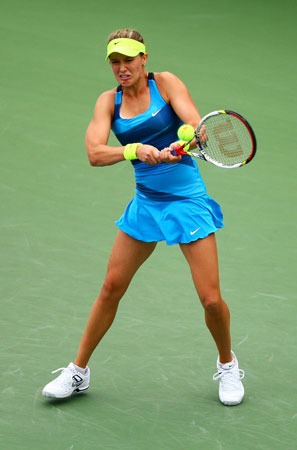 Eugenie Bouchard of Canada returns a shot against Victoria Duval of the United States during Day Eleven of the 2012 US Open.