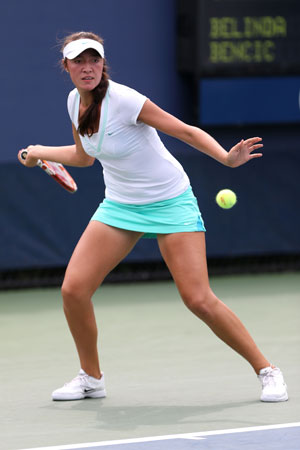 Samantha Crawford of the United States in action during her girls' singles second round match against Belinda Bencic of Switzerland on Day Eleven of the 2012 US Open.