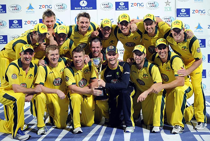 Australia pose with the trophy after winning the series 2-1. -Photo by AFP
