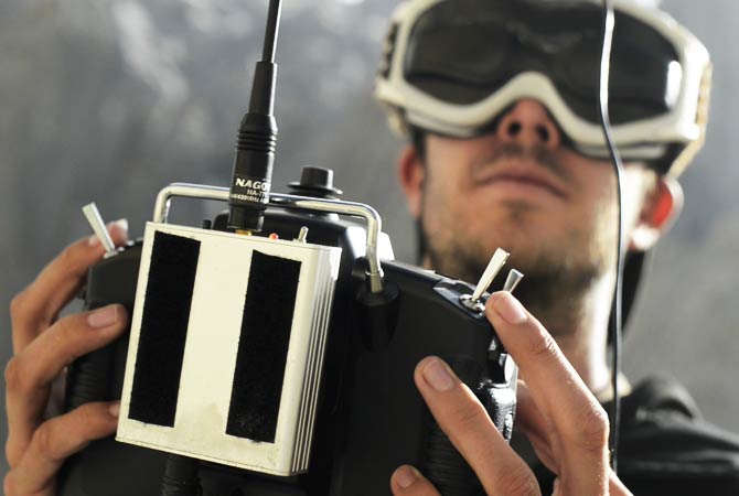 Remo Masima operates a remote-controlled helicopter from the base camp of the Trango Summit in northern Pakistan's Karakoram mountain range. ? Photo by AP