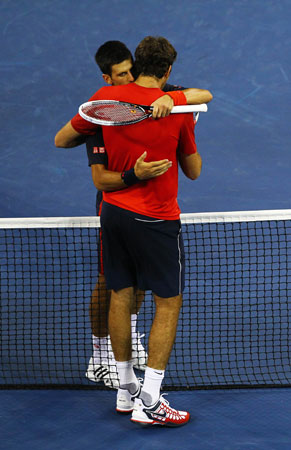 Novak Djokovic of Serbia hugs Juan Martin Del Potro of Argentina after their men's singles quarterfinal match against Juan Martin Del Potro of Argentina on Day Eleven of the 2012 US Open.