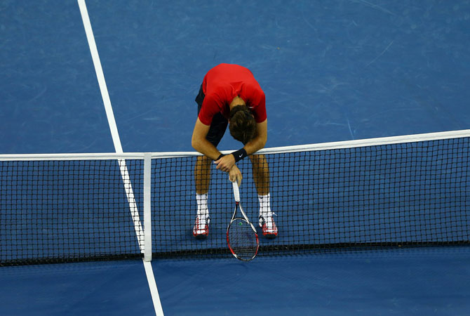 Juan Martin Del Potro of Argentina leans on the net during his men's singles quarterfinal match against Novak Djokovic of Serbia on Day Eleven of the 2012 US Open.