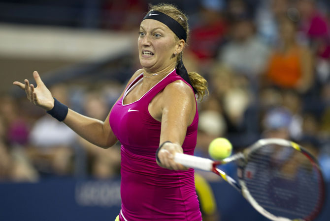 Petra Kvitova of the Czech Republic hits a return to Marion Bartoli of France during their women's singles fourth round match at the 2012 US Open tennis tournament. Bartoli won 1-6, 6-2, 6-0.