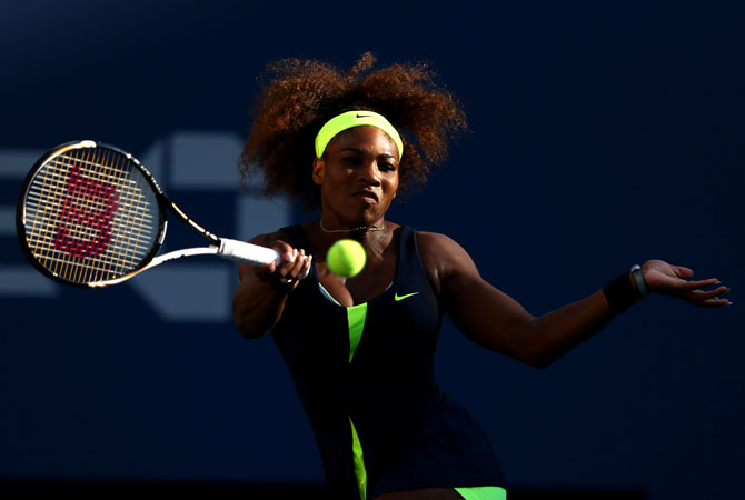 Serena Williams of the United States returns a shot during the women's singles final match against Victoria Azarenka of Belarus.