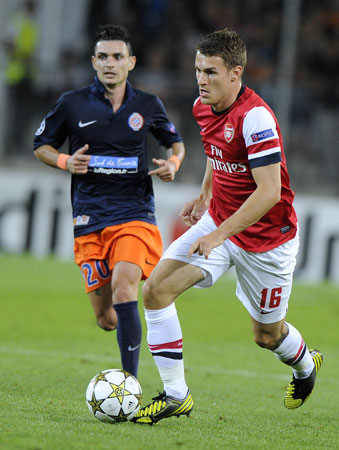 Arsenal's British midfielder Aaron Ramsey (Right) vies with Montpellier's French midfielder Remy Cabella during the UEFA Champions League. ? Photo by AFP