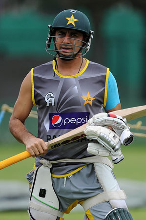 Pakistan cricketer Saeed Ajmal carries his equipment during an ICC Twenty20 Cricket World Cup practice session. ? Photo by AFP