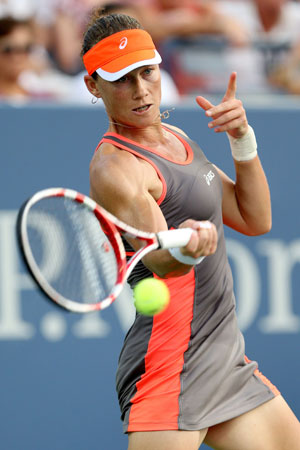 Samantha Stosur of Australia returns a shot during her women's singles fourth round match against Laura Robson of Great Britain on Day Seven of the 2012 US Open.