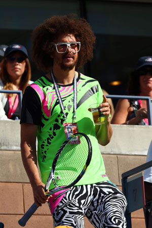 Stefan 'Redfoo' Gordy of the American electro duo LMFAO takes his seat for the start of the women's singles final match between Serena Williams of the United States and Victoria Azarenka of Belarus.