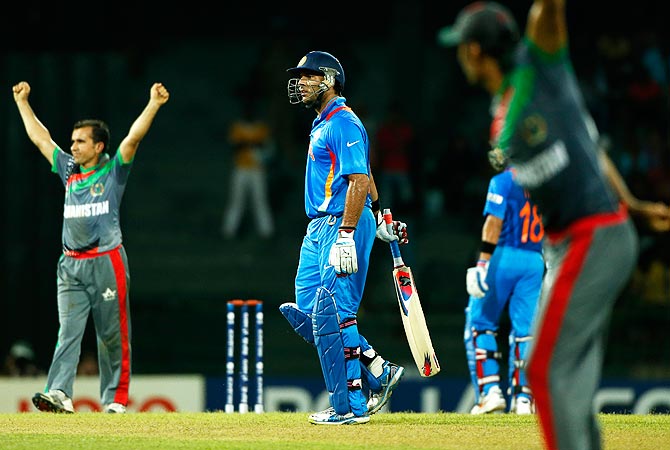 India's batsman Yuvraj Singh, center, leaves the filed after being dismissed. -Photo by AP