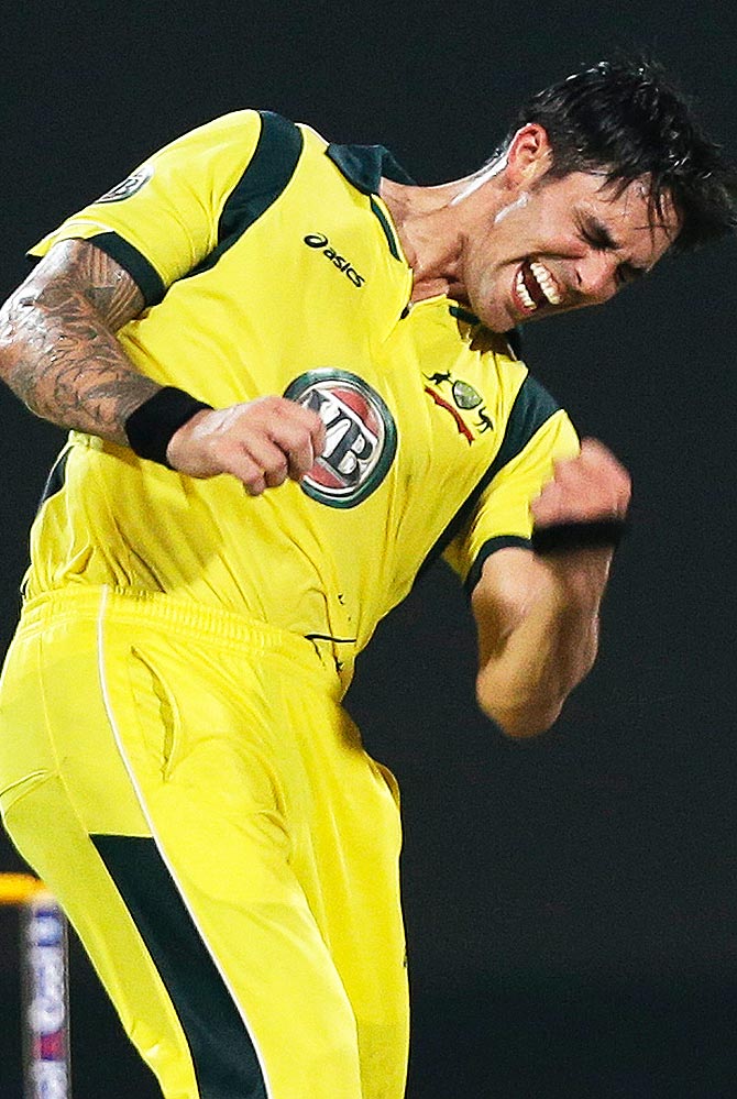 Mitchell Johnson celebrates taking the wicket of Pakistan's Nasir Jamshed. -Photo by AFP