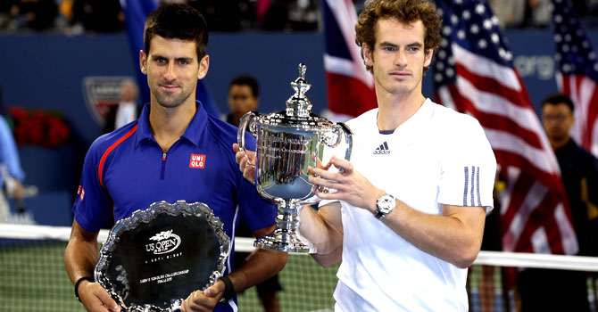 murray-djokovic-final-afp-670 Andy Murray of Great Britain poses with the US Open championship trophy next to Novak Djokovic of Serbia after his victory in the men's singles final match on Day Fifteen of the 2012 US Open — Photo by AFP