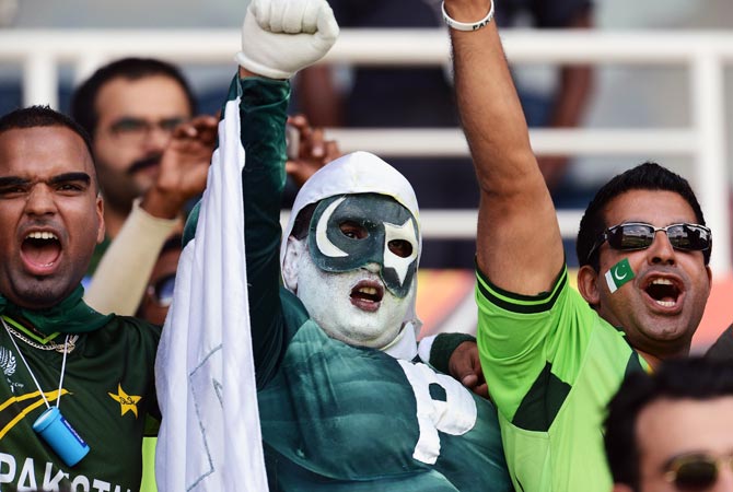 Pakistan fans cheer during the ICC Twenty20 Cricket World Cup match between Pakistan and New Zealand. -Photo by AFP