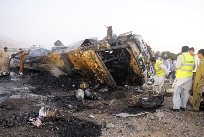 Volunteers search for blast victims.