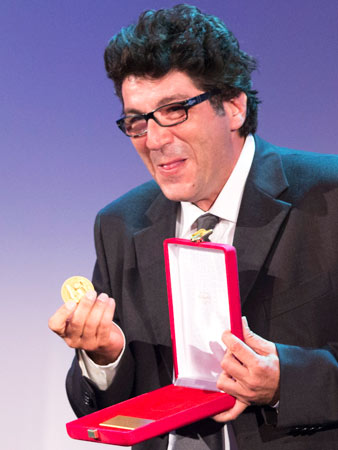 Director Daniele Cipri' shows his prize for Best Photography for his movie 'E' Stato Il Figlio'.