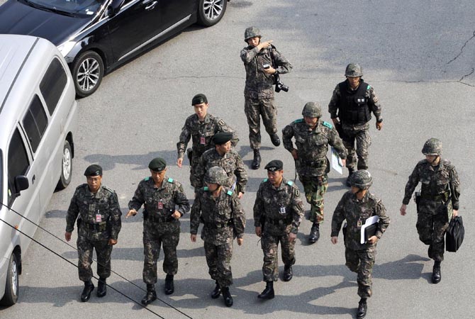 South Korean Army officers arrive to check the security at Imjingak in Paju near the border village of Panmunjom in the demilitarized zone that separates the two Koreas. North Korea's military threatened to strike a South Korean border area where anti-Pyongyang activists plan to launch leaflets from balloons Monday, Oct. 22. South Korea immediately vowed to retaliate if attacked. ?AP Photo
