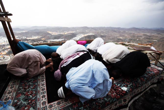 Muslims pray at the top of Mount Noor. ? Photo by Reuters