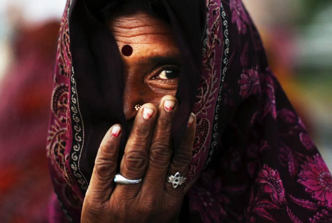 An Indian landless farmer waits for the start of the day's march during the "Jan Satyagraha," near Agra, India. ? Photo by AP