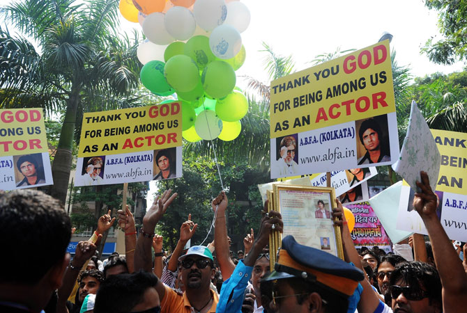 Fans of Indian Bollywood actor Amitabh Bachchan gather outside his residence on his 70th birthday in MumbaI. India's favourite film star and Bollywood legend, Bachchan - who is known as the ?The Big B? having over 3.5 million Twitter followers is treated like royalty in the movie-mad country. ? Photo by AFP
