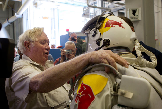 In this Nov. 8, 2011, photo provided by Red Bull Stratos, retired U.S Air Force Col. Joe Kittinger, left, and pilot Felix Baumgartner of Austria greet each other during the Brooks chamber test for Red Bull Stratos. The Red Bull Stratos team brings together the world's leading minds in aerospace medicine, engineering, pressure suit development, capsule creation and balloon fabrication. ? Photo by AP