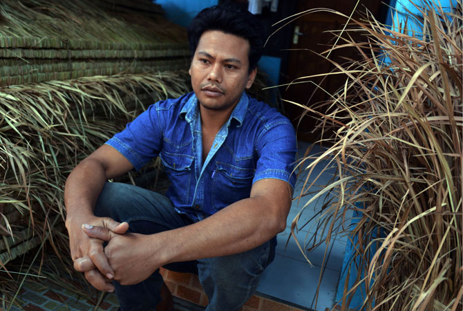 A mental disorder patient, Komang Sudianta, 29, sits in front of his house in Karangasem. World Mental Health Day, which is supported by the United Nations (UN), is annually held on October 10 to raise public awareness about mental health issues worldwide.