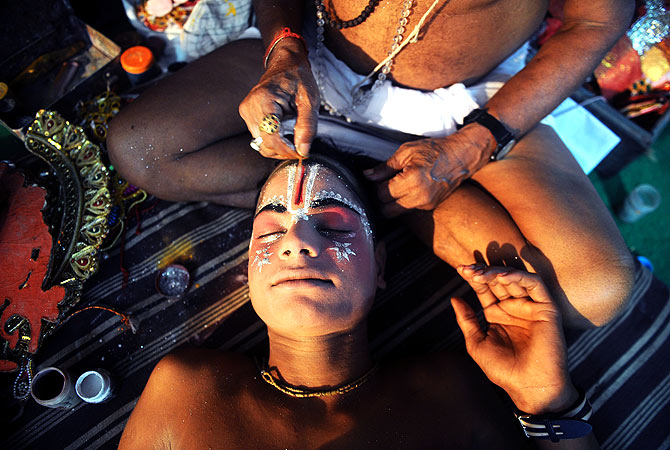 Young Indian artist Ajay Kumar, 15, prepares for a show backstage at the Maharashtra Ramlila Manch.