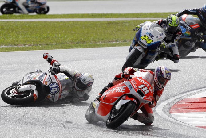 Moto2 rider Ratthapark Wilairot of Thailand falls during Malaysian Motorcycle Grand Prix in Sepang, Malaysia.?AP Photo