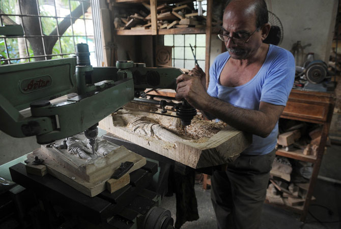 The process begins with a clay modelling, checked several times by a family member to ensure the likeness.