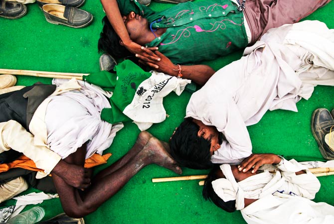 Indian landless villagers rest in Agra, about 185 kilometers southeast of New Delhi. ? Photo by AP