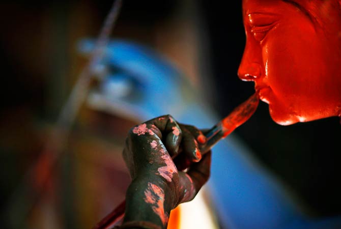 An artist paints idols of Hindu warrior goddess Durga, who destroys demons to prevail over evil. ? Photo by AP