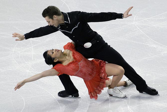 Lynn Kriengkrairut, bottom, and Logan Giuliette-Schmitt skate during the ice dance short dance in the Skate America figure skating event.?AP Photo