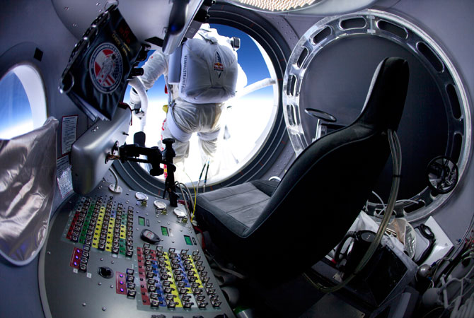 In this March 15, 2012, photo provided by Red Bull Stratos, pilot Felix Baumgartner of Austria prepares to jump at the first manned test flight for Red Bull Stratos in Roswell, N.M. On Tuesday, Oct. 9, 2012, if winds allow, in the desert surrounding Roswell, Baumgartner will attempt to break Kittinger's world record for the highest and fastest free fall. ? Photo by AP