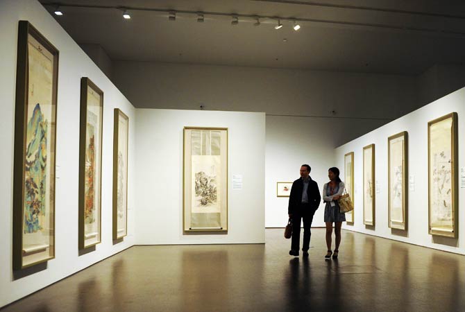 People attend a preview visit to The China Art Museum. ? Photo by AFP